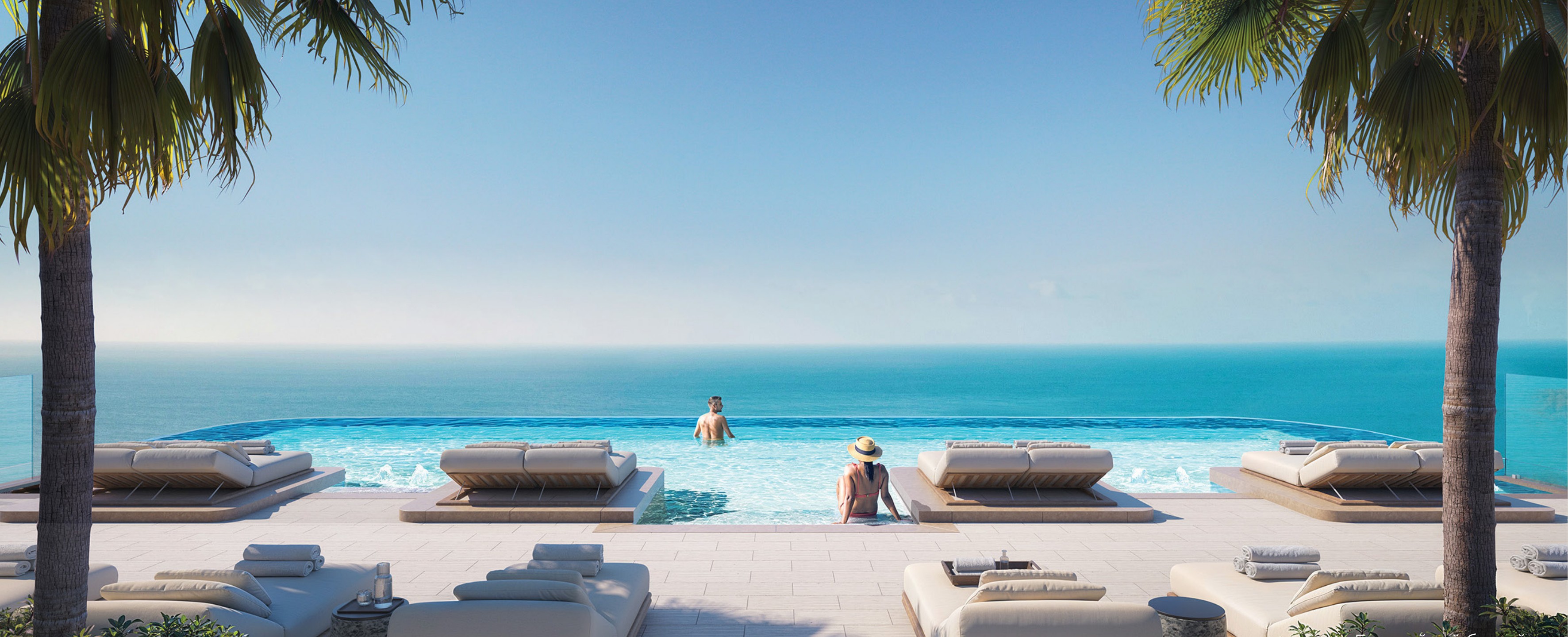 Rooftop infinity pool deck framed by palms with cabanas facing the sea