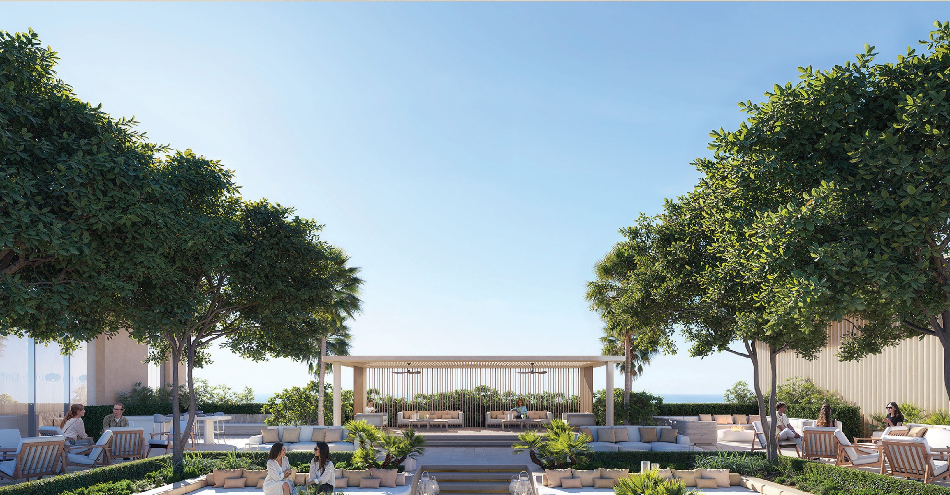 Rooftop sky pavilion with a shaded lounge, gardens and the sea beyond